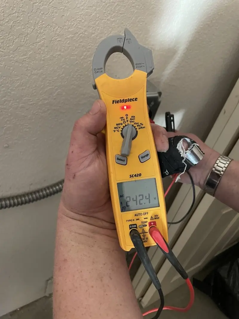 Voltage testing with clamp meter during Outlet Installation in Affton